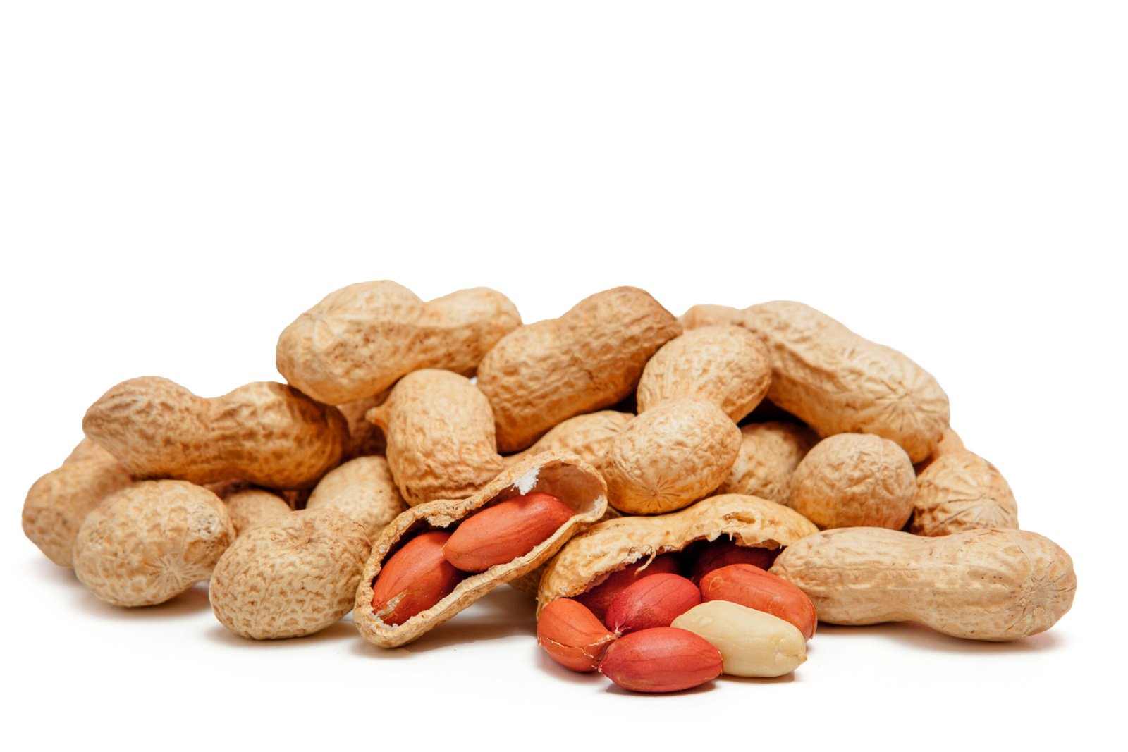 large peeled peanuts close up of beans in the shell isolated on white background . unpeeled peanuts in the shell. peanuts, for background or texture. growing organic protein